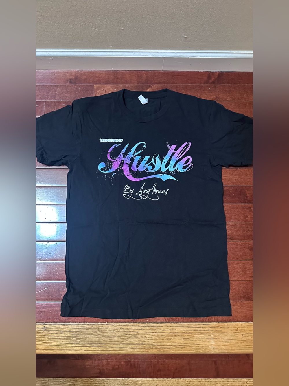ILL Currency Black Graphic T‑Shirt with Gradient 'Hustle' Script